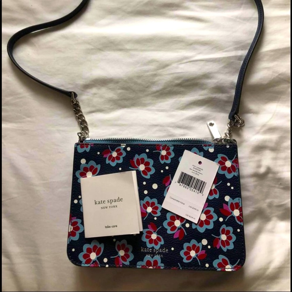 Kate Spade chain crossbody purse 
Eva seaside blooms 
Navy blue 
NEW WITH TAGS